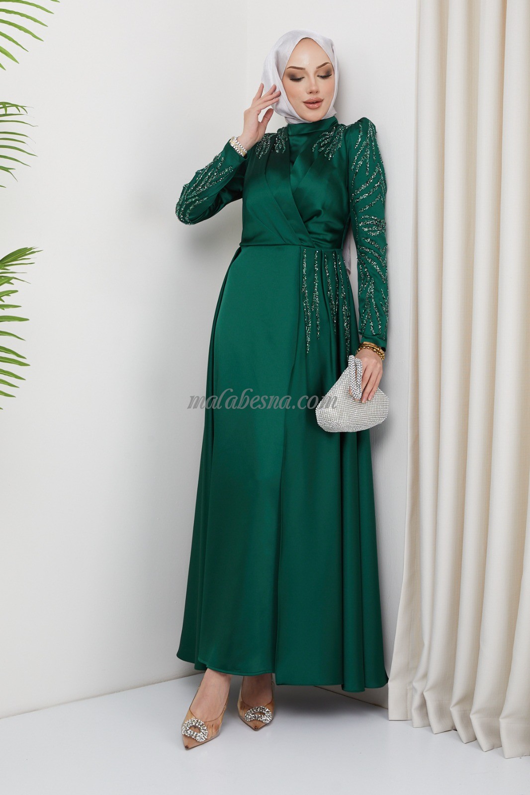 Green evening dress with attached skirt with shining stones